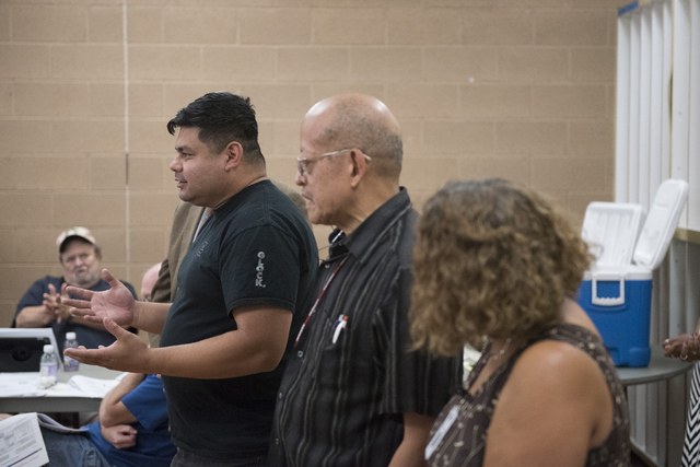 Richard Carreon directs a question to Cass Palmer, North Las Vegas director of Neighborhood and Leisure Services, at Dr. William U. Pearson Community Center in North Las Vegas, Saturday, July 11, ...