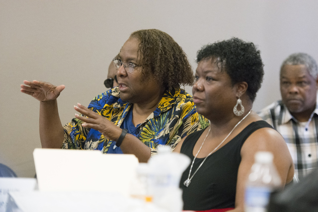Tony Thornton, left, directs a question to Cass Palmer, North Las Vegas Director of Neighborhood and Leisure Services, at Dr. William U. Pearson Community Center in North Las Vegas, Saturday, July ...