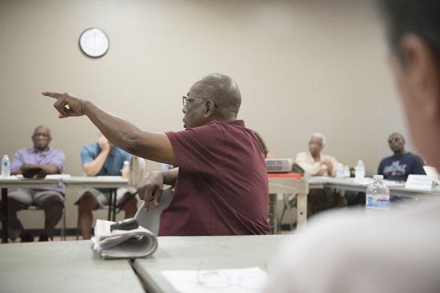 Gene Collins, center, addresses a question to Melanie Braud, development and modernization coordinator, during North Valley Leadership Team's meeting at Dr. William U. Pearson Community Center in ...