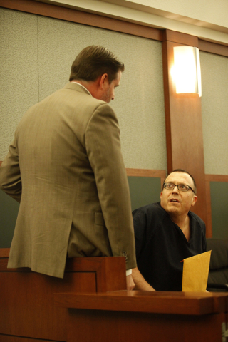 Paul Herron speaks to his lawyer Daniel Page in Judge Michael Villani's court on Thursday, June 4, 2015, in Las Vegas. Herron, who was sentenced on June 4, needed mental health services but inste ...