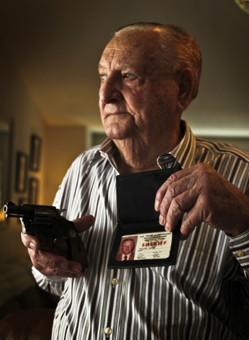 Former Clark County Sheriff Ralph Lamb poises with is service revolver and badge at his northwest Las Vegas home, Friday, Aug. 3, 2012. The upcoming television series,"Vegas," scheduled … | Las Vegas Review-Journal