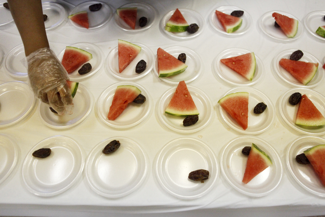 Watermelon and dates are laid out for Muslims looking to break their fast at the Islamic Society of Nevada on Sunday, July 5, 2015 in Las Vegas. During Ramadan some Muslims do not eat or drink dur ...