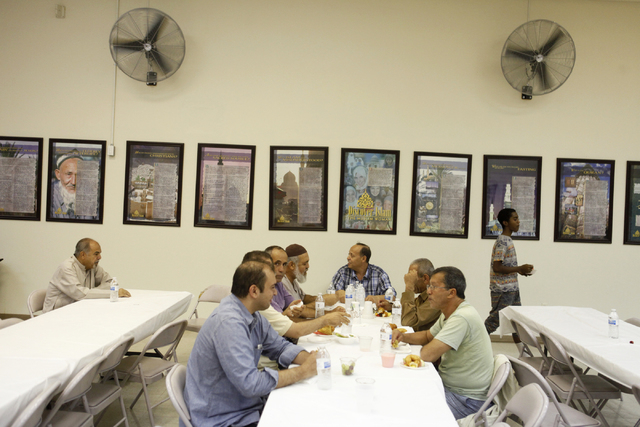 Men break their fast at the Islamic Society of Nevada on Sunday, July 5, 2015 in Las Vegas. During Ramadan some Muslims do not eat or drink during the day. (James Tensuan/Las Vegas Review-Journal) ...