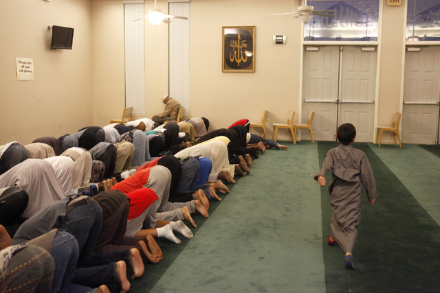 A young boy joins other Muslims at the Islamic Society of Nevada for evening prayers on Sunday, July 5, 2015 in Las Vegas. During Ramadan some Muslims do not eat or drink during the day. (James Te ...