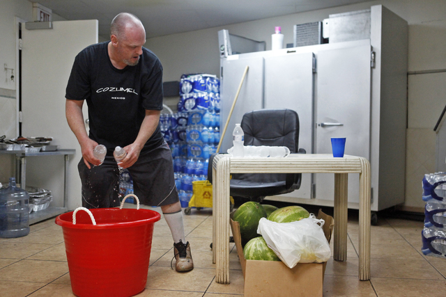 Monti Ali Ciski puts water away after members of the Islamic Society of Nevada broke their fast on Sunday, July 5, 2015 in Las Vegas. During Ramadan some Muslims do not eat or drink during the day ...