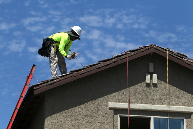 A roofer lays down tiles at Adaven Homes on Wednesday, July 1, 2015, in North Las Vegas. This past June was the hottest on record. (James Tensuan/Las Vegas-Review Journal) Follow James Tensuan on ...