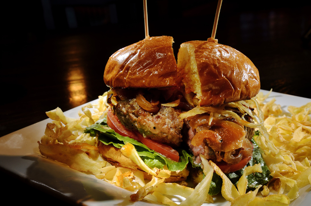 The Cure is shown at Remedy's Tavern at 530 Conestoga Way in Henderson. The burger is made with ground beef and pork stuffed with fontina cheese and topped with soy-marinated onions, jalapeno jell ...