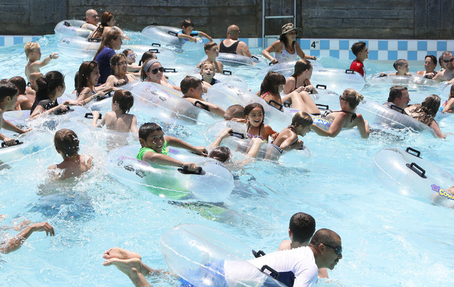 Swimmers play on a hot day at Surf-A-Rama Wave Pool at Cowabunga Bay Water Park in Henderson, Saturday, June 27, 2015. An excessive heat warning will be in effect until 9 p.m. as temperatures are ...