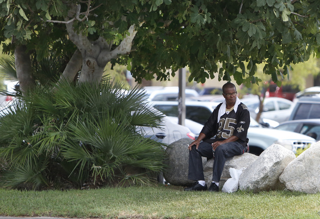 A man takes a break on Paradise Rd. near Howard Hughes Pkwy., on Thursday, July 9, 2015. (Bizuayehu Tesfaye/Las Vegas Review-Journal) Follow Bizu Tesfaye on Twitter @bizutesfaye