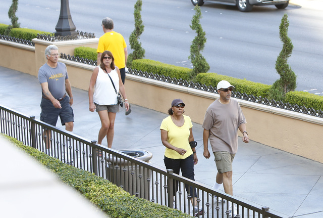 Tourists walk along the Strip near The Palazzo hotel-casino Friday, July 10, 2015. (Bizuayehu Tesfaye/Las Vegas Review-Journal) Follow Bizu Tesfaye on Twitter @bizutesfaye