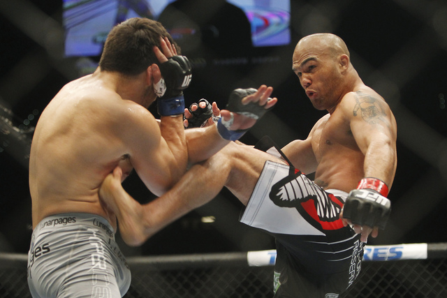 Robbie Lawler, right, kicks Jake Ellenberger during UFC 173 at the MGM Grand Garden Arena in Las Vegas on Saturday, May 24, 2014. (Jason Bean/Las Vegas Review-Journal)
