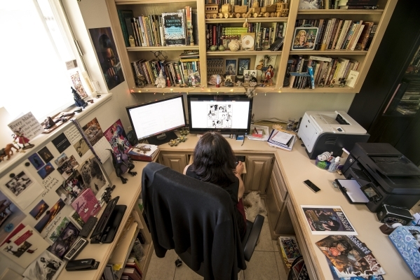 Deborah Daughetee reviews artwork for her "Gates of Midnight" comic at her home office in Las Vegas. She owns Kymera Press and offers her stories in both print and digital versions.
Jo ...
