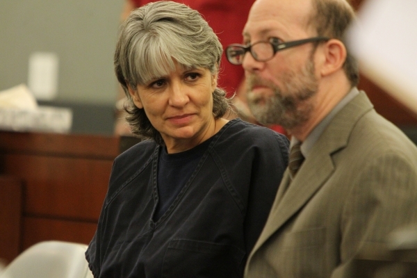 Jerry Meador, left, convicted of theft charges, speaks to her attorney Dayvid Figler during her court hearing for an opportunity to participate in a rarely used diversion for problem gamblers at t ...