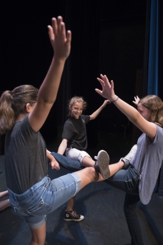 Sage Fernandez, 11, center, works on exercises with other young performers in the Rainbow Company Youth Theatre at Charleston Heights Arts Center. The company will present five plays during the 20 ...