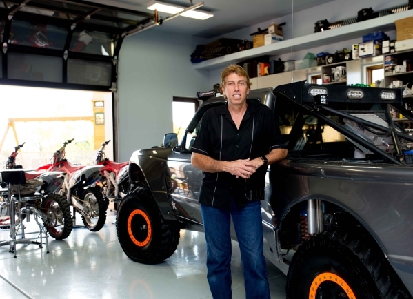 Las Vegas homebuilder Daniel Coletti built his The Ridges estate in Summerlin with a  1,250-square-foot attached garage capable of accommodating six vehicles and an adjacent 1,100-square-foot deta ...