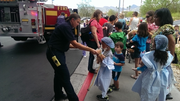 Children dress up as doctors and chat with Las Vegas Fire & Rescue workers during the Teddy Bear Clinic at Centennial Hills Hospital, 6900 N. Durango Drive, Aug. 5. (Special to View)