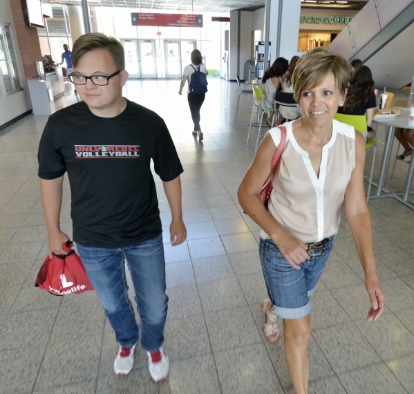 Clayton Rhodes, left, walks through the UNLV Student Union with his mom, Shelley, on his way to the bookstore. (Bill Hughes/Las Vegas Review-Journal)
