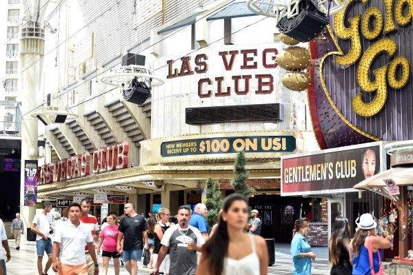 Tourists walk along the Fremont Street Experience in front of the Las Vegas Club hotel-casino on Monday, Aug. 17, 2015, in Las Vegas. The the 86-year-old sports-themed downtown property was recent ...