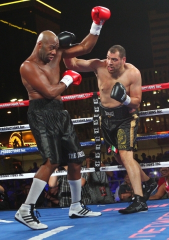 Trevor Bryan, left, blocks a punch from Derric Rossy during their NABF heavyweight title fight at the Downtown Las Vegas Events Center in Las Vegas on Friday, Aug. 28, 2015. Chase Stevens/Las Vega ...