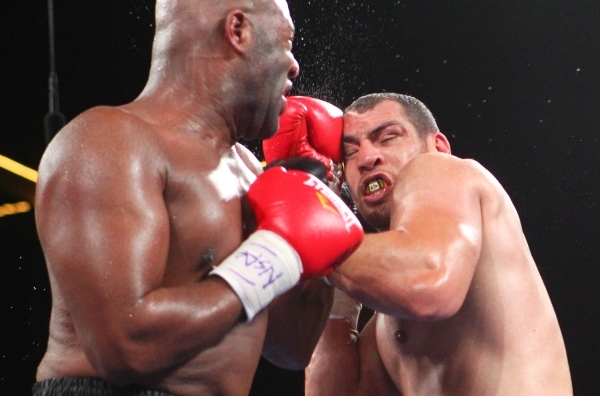 Trevor Bryan, left, lands a punch against Derric Rossy during their NABF heavyweight title fight Friday at the Downtown Las Vegas Events Center. Bryan (16-0) won a 10-round unanimous decision. CHA ...