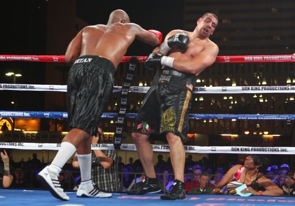 Trevor Bryan, left, keeps Derric Rossy against the ropes during their NABF heavyweight title fight at the Downtown Las Vegas Events Center in Las Vegas on Friday, Aug. 28, 2015. Chase Stevens/Las  ...