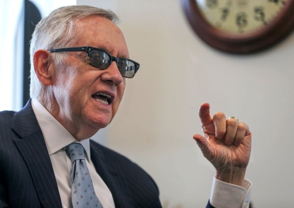 U.S. Sen. Harry Reid, D-Nev., answers media questions in his office in Reno earlier  this month. Reid says NV Energy needs to embrace the new solar technology. Cathleen Allison/Las Vegas Review-Jo ...