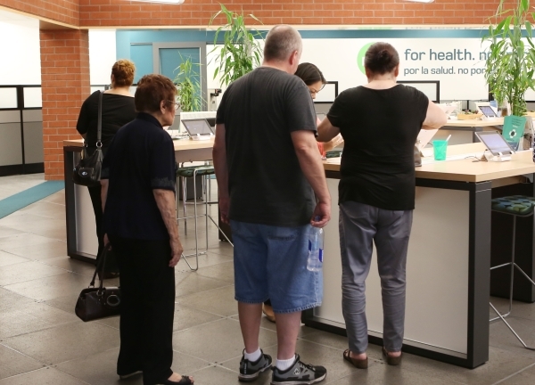 People are seen being assisted by the Nevada Health CO-OP crew member at the co-op‘s walk-in center on 3900 Meadows Ln. Wednesday, Aug. 26, 2015. A nonprofit insurer created by the Affordabl ...