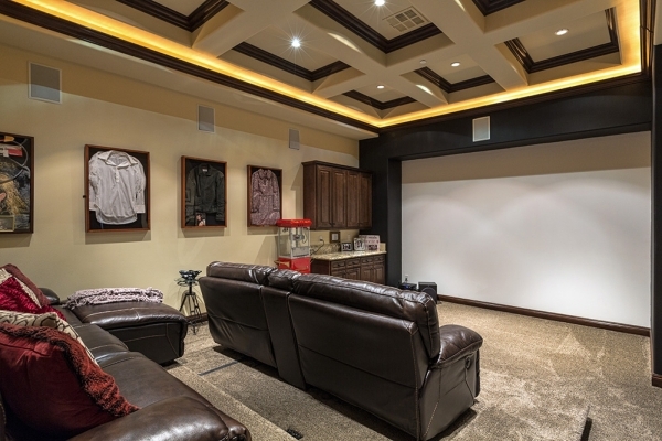 The home‘s movie theater has leather recliner seating for seven. Showcased on the walls are shadow boxes holding a Judy Garland-owned blouse, a shirt John Travolta wore in the movie "Tw ...