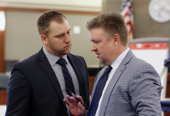 A former UNLV, Bishop Gorman player Beau Orth, left, listens to his attorney Dennis Prince prior to the start of the trial at the Regional Justice Center in Las Vegas Friday, Aug. 28, 2015. Orth i ...