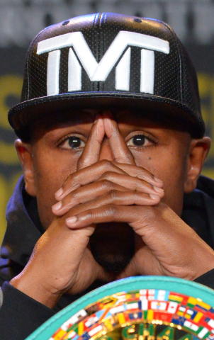 Welterweight champion Floyd Mayweather Jr. listens during a news conference Thursday in Los Angeles to promote his title fight against Andre Berto on Sept. 12 at the MGM Grand Garden. JAYNE KAMIN- ...