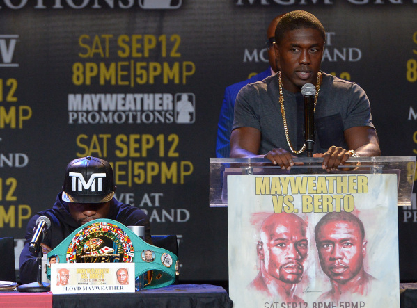Challenger Andre Berto speaks and welterweight champion Floyd Mayweather Jr. listens during a news conference Thursday in Los Angeles to promote their title fight Sept. 12 at the MGM Grand Garden. ...