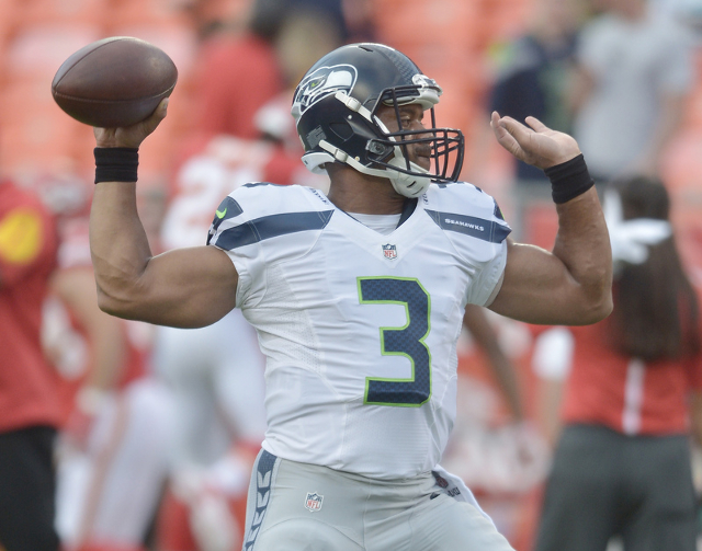 Aug 21, 2015; Kansas City, MO, USA; Seattle Seahawks quarterback Russell Wilson (3) warms up prior to the game against the Kansas City Chiefs during the first half at Arrowhead Stadium. (Denny Med ...