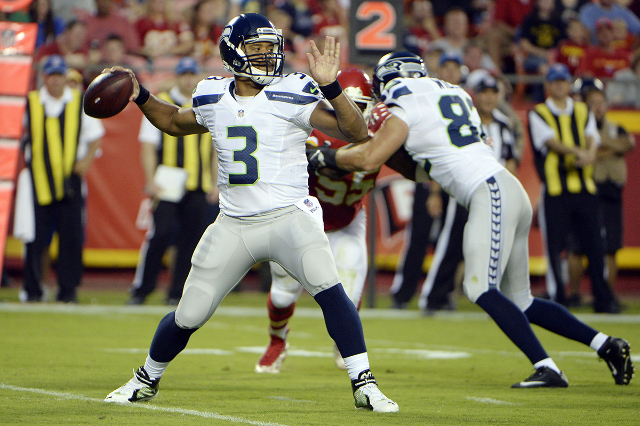 Aug 21, 2015; Kansas City, MO, USA; Seattle Seahawks quarterback Russell Wilson (3) throws a pass against the Kansas City Chiefs in the first half at Arrowhead Stadium. (John Rieger/USA Today Sports)