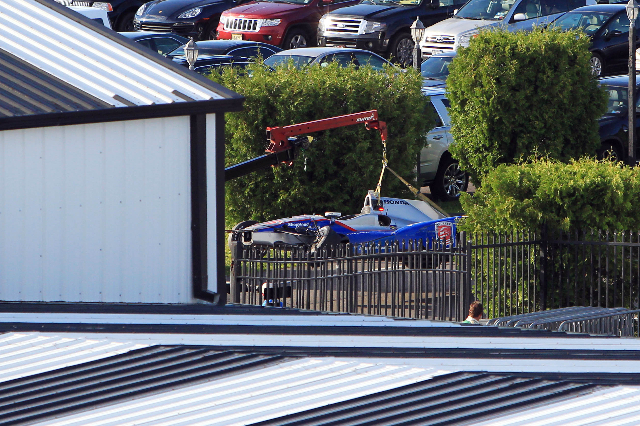 Aug 23, 2015; Long Pond, PA, USA; The car of Verizon IndyCar Series driver Justin Wilson (not pictured) is towed into the garage following an accident during the ABC Supply 500 at Pocono Raceway. ...