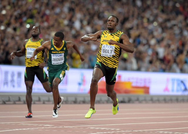 Aug 27, 2015; Beijing, China; Usain Bolt (JAM) wins the 200m in 19.55 during the IAAF World Championships in Athletics at National Stadium. From left: Nickel Asheade (JAM), Anaso Jobodwana (RSA an ...