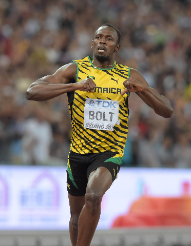 Aug 27, 2015; Beijing, China; Usain Bolt (JAM) celebrates after winning the 200m in 19.55 during the IAAF World Championships in Athletics at National Stadium. (Kirby Lee/USA Today Sports)