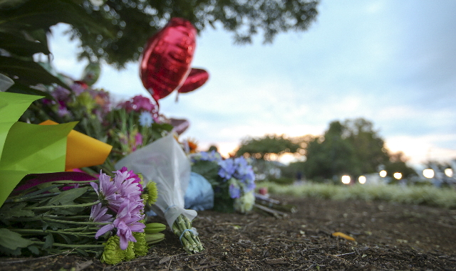 Flowers are seen at a memorial outside of the offices for WDBJ7 where killed journalists Alison Parker and Adam Warm worked in Roanoke, Virginia August 27, 2015.  REUTERS/Chris Keane