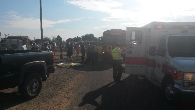 Two students and two adults were injured in a crash between a school bus and a car in Kingman, Arizona, Thursday morning, Aug. 13, 2015. (Dave Hawkins/Special to Las Vegas Review-Journal)