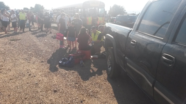 Two students and two adults were injured in a crash between a school bus and a car in Kingman, Arizona, Thursday morning, Aug. 13, 2015. (Dave Hawkins/Special to Las Vegas Review-Journal)