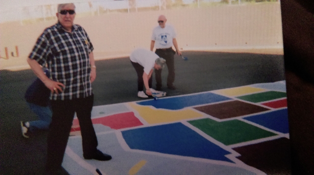 Karl Luebeck and members of the Desert Sands Life Member Club paint a map of the United States at a Las Vegas elementary school. Karl and Mary Luebeck volunteered with the club from the time they ...