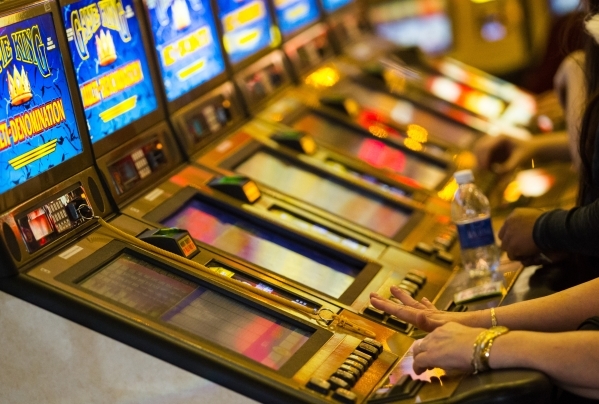 People play on slot machines at Main Street Station May 26. The Problem Gambling Center in Las Vegas was founded in 1998 as a nonprofit supported by the gaming industry to help gambling addicts. ( ...