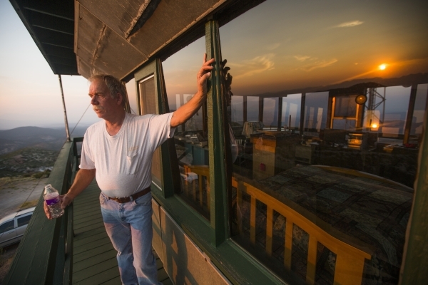 Bureau of Land Management fire outlook employee John Dubovick  watches the sunset at the  Ella Mountain fire watchtower on Wednesday, Aug. 19, 2015.JEFF SCHEID/LAS VEGAS REVIEW-JOURNAL