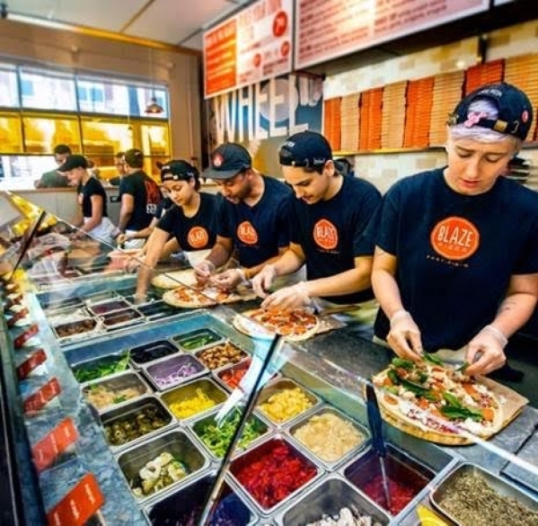 The workers at Blaze Pizza will be busy preparing free pizzas on Friday to celebrate the opening of their new outlet at the Decatur 215 Shopping Center. (Courtesy photo)