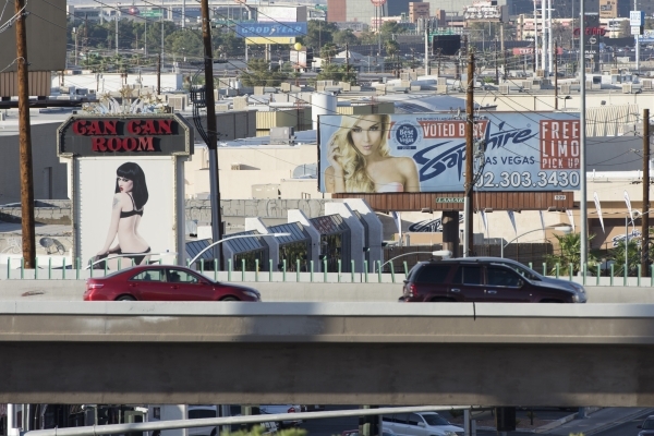 Signage for strip clubs Can Can Room and Sapphire, are shown from the MGM Resorts International office on South Industrial Road, in Las Vegas Friday, Sept. 4, 2015. (Jason Ogulnik/Las Vegas Review ...
