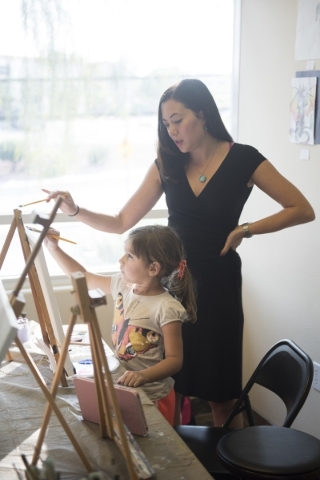 Student Leyla Rosles, 6, is given instruction by Sarah King during a private painting lesson at The King Art Studio in Henderson, Wednesday, Aug. 19, 2015. (Jason Ogulnik/Las Vegas Review-Journal)