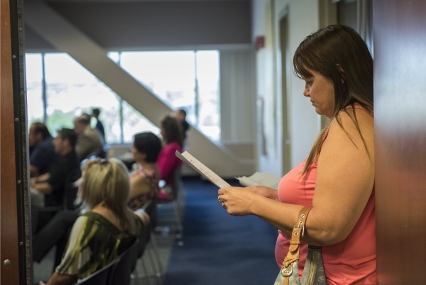 Concerned parent Kristi Barile, reads over notes during a pubic workshop about Nevada‘s upcoming new Education Savings Account held at the State Treasurer‘s office inside the Grant Saw ...