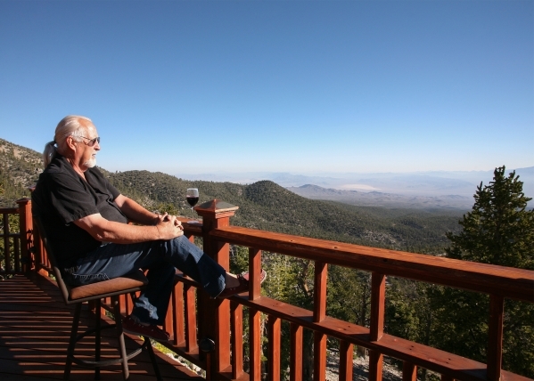 Ennis Jordan looks out over the Toiyable National Forest from his Mount Charleston vacation home. ELKE COTE/REAL ESTATE MILLIONS