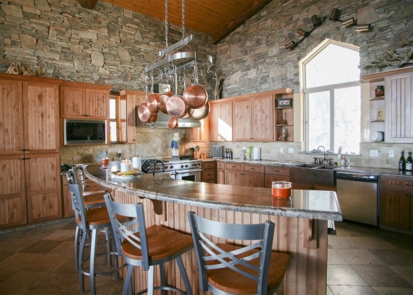 The kitchen has all the upgraded Wolf appliances, an island with seating, pantry and two copper sinks. ELKE COTE/REAL ESTATE MILLIONS