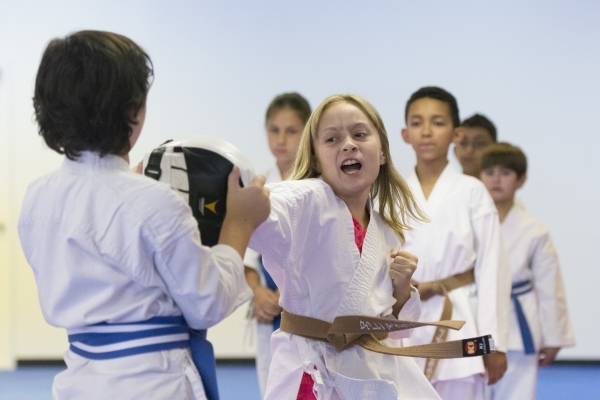 Ten-year-old Lauren McClanahan throws a punch during a class at Hiroshi Allen Karate Elite Training Center in Las Vegas Wednesday, Sept. 9, 2015. (Jason Ogulnik/Las Vegas Review-Journal)