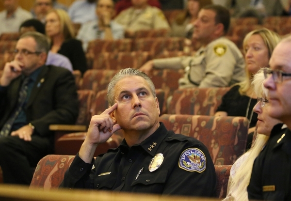 Henderson Police Deputy Chief Todd Peters, center, attends a public hearing for More Cops sales tax at of a County Commission meeting at the commission chambers Tuesday, Sept. 1, 2015, in Las Vega ...